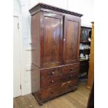 An early Victorian mahogany linen press, the cavetto cornice over a pair of flame mahogany