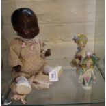 A German Black doll, monogrammed LK 933 with open mouth, 31cm and two Victorian dolls house dolls