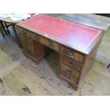 A mahogany pedestal desk, the leather inset top over three drawers, each pedestal with a further