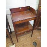 An early 19th century inlaid mahogany washstand, the three quarter gallery above a centre drawer