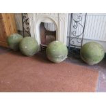 Four York stone globes, 36cm diameter