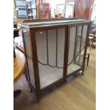*A 1920's walnut glazed display cabinet, with two doors on cabriole legs 119cm wide