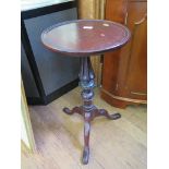 A mid Victorian style mahogany tripod table, on a turned and fluted stem and cabriole legs, top 35cm