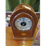 An Edwardian inlaid mahogany cased 'Bulle' battery powered clock, the pointed arch case with