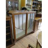 A 1930's walnut and glazed display cabinet, on cabriole legs with club feet. 120cms wide