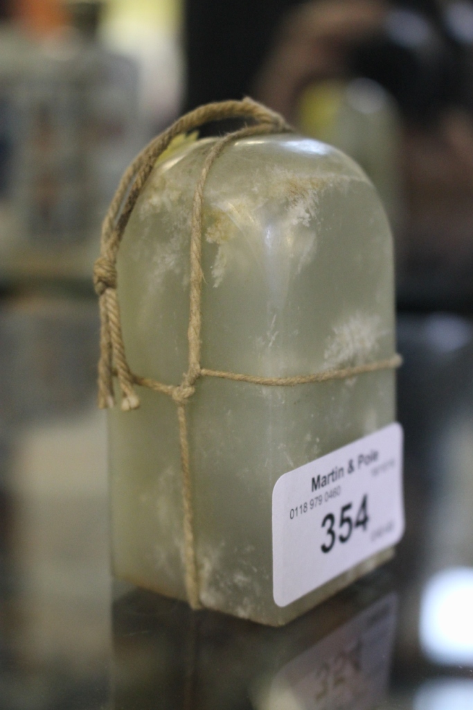 A Chinese jade rectangular seal, with rounded top, 7cm high