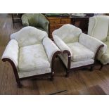 A pair of mahogany framed upholstered armchairs, with shaped back, the scroll arms carved with husks