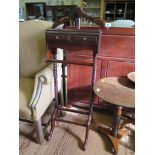 A mahogany stain gentleman's clothes horse with coat hanger, two trinket drawers and rail over