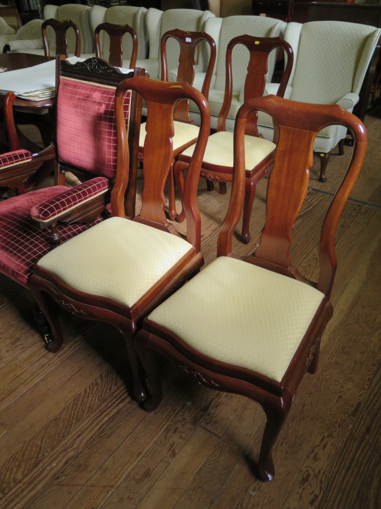 A set of six Malaysian teak Queen Anne style dining chairs, with vase shape splats, carved moulded