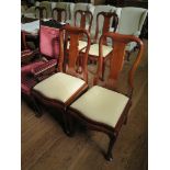 A set of six Malaysian teak Queen Anne style dining chairs, with vase shape splats, carved moulded