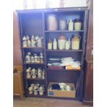 An oak open bookcase, the moulded cornice over two sections of adjustable shelves, 127cm wide