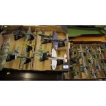 A collection of 24 die cast models of miltary aircraft, all on display stands