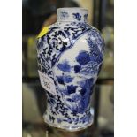 A Chinese blue and white vase, Kangxi style, of baluster form, the panels depicting birds above