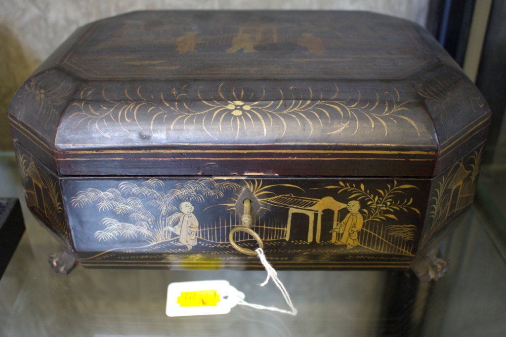 A 19th Century Chinese lacquered sewing box, of octagonal form, the lid depicting figures in a