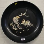 A Chinese lacquered papier mache charger depicting cockerals in mother of pearl, 39cm diameter