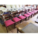 A set of eight Regency style reproduction mahogany dining chairs with brass inlaid backs and sabre