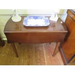 A mahogany Pembroke table, by Strongbow furniture, the shaped top and leaves over a frieze drawer on