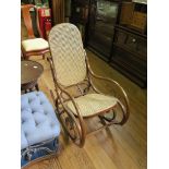 A Bentwood and cane rocking chair