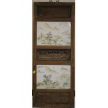 Two Chinese porcelain panels depicting landscapes and inscribed, set into a carved hardwood panel,