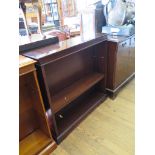 A reproduction mahogany open bookcase on bracket feet, 95cm wide