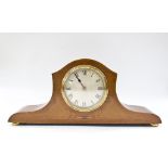 An Edwardian mahogany and chevron banded mantel timepiece, the shaped broad case with boxwood