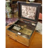 A walnut cased 9 1/2 inch polyphon, with Schutze Marke medallion, the white resin inlaid lid with