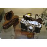 A Leica III camera no. 345999, f5cm 1:3.5 lens with leather case