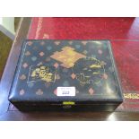 An early 20th century lacquered playing card gaming box depicting the suits and Chinese motifs,