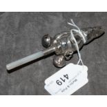 A silver 925 baby rattle modelled as Peter Rabbit with mother of pearl handle and two bells