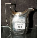 A Georgian silver cream jug with bright work decoration, London 1798