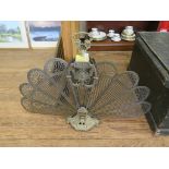 A Victorian brass fan shape folding firescreen, the central support cast with profile masks, swags