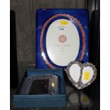A Waterford crystal photo frame in box, together with small silver plated heart shape double frame