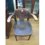 A Bentwood armchair, with tapering splat, pressed seat and turned tapering legs