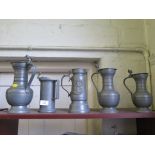 A collection of pewter flagons and jugs