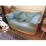 An Ercol ash Renaissance design two seat sofa 146cms wide