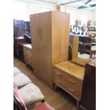 A G-Plan 'Brandon' oak bedroom suite, 1950s comprising a two door wardrobe, a dressing table with