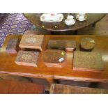 A collection of seven various brass inlaid and carved decoration boxes