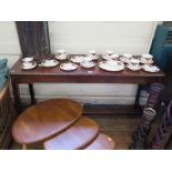 A mahogany and stained beech side table, the rectangular top on square section legs joined by