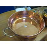 A 19th century copper preserve pan with twin handles 62cm diameter, and a copper and brass bucket