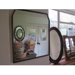 A 1920's oak oval wall mirror 74cm high and two others (3)