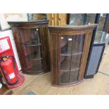 A pair of mahogany and chequer banded corner cupboards, the dentil cornices over glazed doors 59cm x