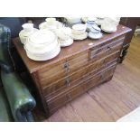 An Edwardian oak chest of two short and two long drawers on bracket feet, 107cm wide