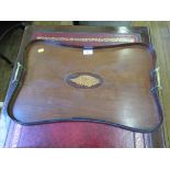 An Edwardian mahogany galleried tray, of waisted rectangular form with inlaid patera and brass