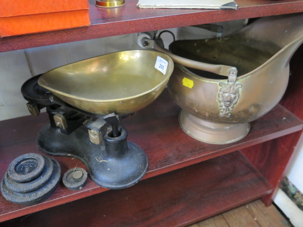 A brass helmet shaped coal scuttle and a set of kitchen scales (2)