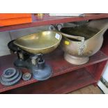 A brass helmet shaped coal scuttle and a set of kitchen scales (2)