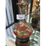 A Chinese cloisonne vase, with long neck and squat body, the red wired field with floral decoration,