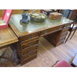 A burr walnut pedestal desk, with leather inset top over three frieze drawers, each pedestal with