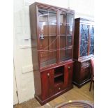 A Stag side cabinet and associated bookcase with two cupboard doors, open shelves and central
