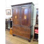 A George III mahogany and satinwood crossbanded linen chest, the cavetto moulded cornice over two