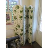 A three fold fabric screen with arched tops, each panel 168cm x 44cm